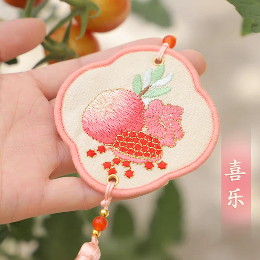 Portable embroidered sachet