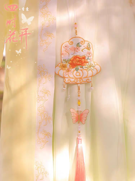 Portable embroidered sachet